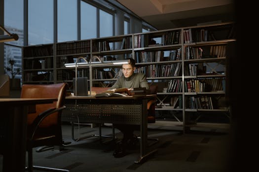 A graduate student practicing deep breathing in a quiet space