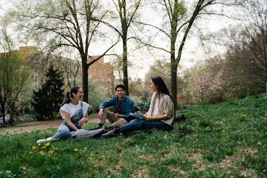 Student relaxing at a park after studying