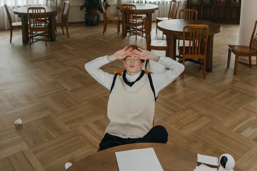 stressed graduate student with books